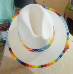 This is a spectacular white rim beaded unisex high quality fedora hat that are hand beaded on the BRIM . It makes one stand out in occassions such trips ,weddings ,birthdays . We use very stunning beads and the craftmanship is very unique Head circumference can fit a size: 57/58cm Women Cowboy Hats, Fedora Hat Summer, Beaded Hats, Fedora Fashion, Beaded Clutch Purse, Beaded Dog Collar, Hat Fedora, Chapeau Cowboy, Beaded Hat