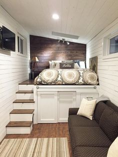 two pictures of a bedroom and living room with stairs leading up to the top floor