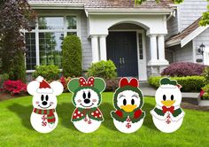 mickey mouse christmas yard decorations in front of a house