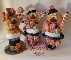 three teddy bears dressed in costumes and candy canes on top of a white background