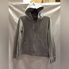 New Never Worn Or Displayed. We Have One Size Medium Left. Casual Silver Hooded Outerwear, Silver Casual Hoodie For Streetwear, Silver Hoodie For Winter, Silver Long Sleeve Hoodie For Winter, Silver Long Sleeve Hoodie For Fall, Silver Hoodie For Winter Streetwear, Silver Casual Winter Hoodie, Silver Casual Hoodie For Winter, Silver Hoodie For Fall Streetwear