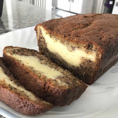 a loaf of cake sitting on top of a white plate