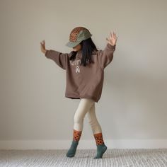 This hat is made by Rad River Co. in collaboration with Summer in May. Features an adjustable velcro back and fabric eyelets on the side panels. Size 1: Designed to fit kids aged 9 to 36 months.Size 2: Designed to fit kids aged 3 to 5 years.Size 3: Designed to fit kids aged 6 to 10 years. *Models 1 and 2 are wearing size 2*Models 3 and 4 are wearing size 3 100% Polyester Playful Adjustable Cotton Hat, Playful Cotton Hat With Adjustable Fit, Playful Adjustable Hats For Fall, Playful Cotton Outdoor Hat, Playful Brown Hat, One Size Fits Most, Playful Brown Cap Hat, Playful Fall Hat One Size Fits Most, Playful Beanie Hat For Playtime, Playful Brown Cap