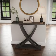 a table with a mirror on it in front of a wall and window sill