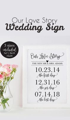 a vase with flowers and a sign that says our love story wedding sign