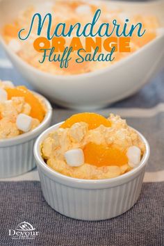 mandarin orange fluff salad with marshmallows in small white bowls on a blue and white tablecloth