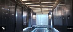 the inside of a large server room with lots of doors and lights on either side