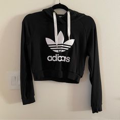 New Without Tags. Size Xs. Trendy Adidas Hooded Sweatshirt, Adidas Black Hoodie For Spring, Trendy Adidas Long Sleeve Hoodie, Adidas Casual Top With Drawstring Hood, Adidas Casual Tops With Drawstring Hood, Adidas Hoodie For Fall, Adidas Fall Hoodie Top, Trendy Long Sleeve Adidas Sweatshirt, Adidas Cropped Hoodie