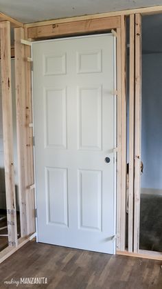 the interior of a house being built with wood framing around the door and window frames