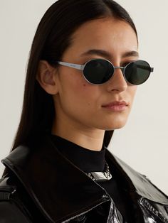 Taking cues from popular '90s styles, SAINT LAURENT's oval-frame sunglasses are re-imagined to suit the sleek modern aesthetic. They're made from silver-tone metal and have black lenses that match the acetate tips and the label's moniker etched along the arms. Ysl Sunglasses, Saint Laurent Accessories, Saint Laurent Sunglasses, Flat Dress Shoes, Gucci Eyewear, Aesthetic Women, Oval Sunglasses, Eyewear Womens, Oval Frame