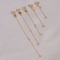 "14k Solid Gold Necklace or Bracelet Extender, Removable Real Solid Gold Extension Chain, Adjustable length 1 , 1.5 , 2 , 2.5 , 3 , 4 inch Yellow Gold , White Gold and Rose Gold Extender S P E C I F I C A T I O N S * MATERIAL: SOLID Gold (Not Gold Filled or Gold Plated) * KARAT: 14 K (real gold) * DIMENSIONS: 0.72mm thickness * COLOR: Yellow Gold, Rose Gold, White Gold * TURN AROUND TIME: 1-3 Business days(ship by date) W E A R ∙ W I T H ∙ J O Y * All our jewelry is custom made by hand with Love Everyday Yellow Gold Jewelry With Extender, Elegant Rolo Chain For Jewelry Making, Classic Jewelry With Extender, Yellow Gold Jewelry With Extender, Minimalist Rose Gold Jewelry With Extender, Dainty Round Chain Bracelet With Extender, Elegant Dangle Jewelry With Extender, Yellow Gold Link Jewelry With Extender, Yellow Gold Chain Bracelet With Extender