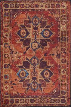 an orange and blue area rug with many different designs on the border, including flowers