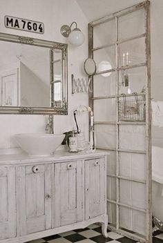 a bathroom with a sink and mirror in it