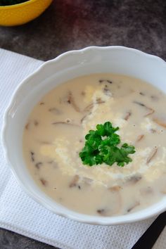 a white bowl filled with soup on top of a table