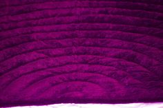 an image of a purple background that looks like fabric