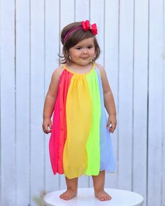 Panels of rainbow colors add a fun flair to this twirl-worthy shift dress. 100% polyester skirt We recommend hand washing and hang drying this article of clothing. Summer Rainbow Dress For Dress-up, Rainbow Dress For Summer Dress-up, Rainbow Dresses For Summer Dress-up, Cute Multicolor Twirl Dress For Spring, Pink Flowy Twirl Dress For Summer, Playful Flowy Summer Dresses, Rainbow Summer Dress For Playtime, Rainbow Summer Dresses For Playtime, Multicolor Twirl Dress For Playtime In Summer