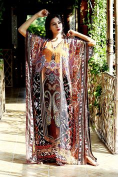 "Plus size silk caftan silk kaftan maxi dress silk dress Luxury kaftan Beach party kaftan Resort wear for women Designer kaftan 113 Bohemian Print Long Silk Kaftan Dress with Beautiful Crystal Work Lightweight kaftan Want to shop for a dress that is comfortable, classy and elegant at the same time? Then this alluring Silk Kaftan dress with glittering crystal work is the best choice for you. The minimal V neckline sets a perfect combination with sassy sidelines of the silk Kaftan dress. The beaut Maxi Dress Silk, Designer Kaftan, Silk Kaftan Dress, Long Kaftan Dress, Silk Caftan, Crystal Work, Kaftan Gown, Beach Caftan, Women Dress Collection