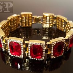 Hip Hop Celebrity Rick Ross Red Ruby Cz Bracelet 14k Gold Plating For A Premium Quality Finish That Will Turn Heads. 18mm Width And 8.5" Length. Luxury Clasp To Lock Your Bracelet Easily And Securely. Celebrity Style High Quality & Polished. Top Quality Cz Stones Luxury Red Rhinestone Jewelry, Red Sparkly Jewelry For Formal Occasions, Classic Red Cubic Zirconia Jewelry, Elegant Red Jubilee Bracelet Jewelry, Red Crystal Bracelet Gift, Elegant Rhinestone Bracelets For Valentine's Day, Red Crystal Bracelet For Gift, Luxury Red Ruby Tennis Bracelet, Iced Out Bracelet Jewelry For Anniversary