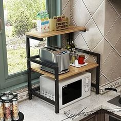 a microwave and toaster on a shelf in a kitchen