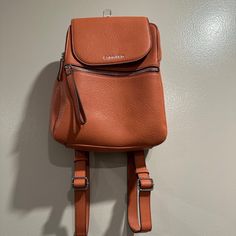 Never Used Orange Calvin Klein Mini Book Bag 5 Compartments Retails For $100 Open To Offers!! Leather Backpack With Cell Phone Pocket For School, Calvin Klein Satchel With Adjustable Strap, Calvin Klein Travel Bag With Removable Pouch, Calvin Klein Bags With Adjustable Strap, Calvin Klein Travel Shoulder Bag With Removable Pouch, Calvin Klein Shoulder Bag With Removable Pouch For Travel, Calvin Klein Travel Shoulder Bag With Detachable Strap, Calvin Klein Crossbody Travel Satchel, Calvin Klein Crossbody Satchel For Travel