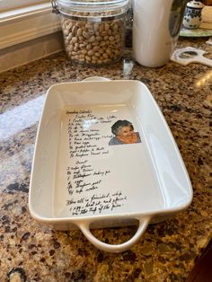 a tray with writing on it sitting on top of a counter