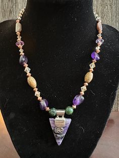 One of a kind, unique and rare choker style necklace hand made from Charoite w/ Silver, Jasper, Amethyst, Copper and  Swavarski crystals. Magnetic clasp. Includes matching Lepidolite studded earrings. Unique Purple Gemstone Bead Necklaces, Unique Amethyst Gemstone Bead Jewelry, Unique Amethyst Gemstone Beaded Jewelry, One Of A Kind Artisan Purple Jewelry, Spiritual Purple Jewelry With Unique Variations, Artisan One-of-a-kind Purple Jewelry, Artisan Jewelry With Purple Natural Stones, Artisan Purple Jewelry With Natural Stones, Unique Amethyst Purple Necklace