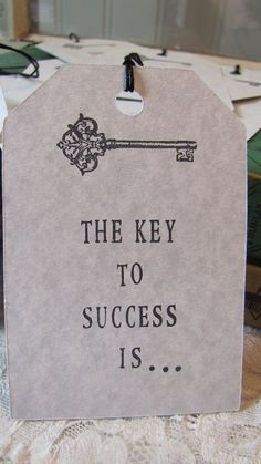 a key to success is hanging on a table