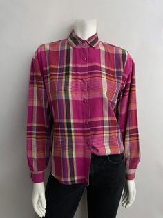 "Vintage 80's Pink, Plaid, Long Sleeve, Flannel by You Babes (S) This Ladies top comes in a magenta pink cotton with a plaid print long sleeves with single wrist button closure with front button closure and collar. 100% Cotton Made in USA *This flannel is in excellent condition. Size: (S) Modern Day 4 (Tag Size: Small) Bust: 42\" Sleeve Length: 21 1/2\" (outside) 19\" (inside armpit to wrist) Length: 24 1/2\" Shoulder to Shoulder: 18\" Weight: 8 oz Follow Freshandswanky on Instagram" Casual Pink Cotton Flannel Shirt, Pink Retro Shirt With Relaxed Fit, Pink Button-up Flannel Shirt For Fall, Pink Cotton Flannel Long Sleeve Shirt, Vintage Pink Long Sleeve Shirt, Pink Long Sleeve Cotton Flannel Shirt, Pink Cotton Long Sleeve Flannel Shirt, Retro Pink Long Sleeve Shirt, Pink Vintage Long Sleeve Shirt