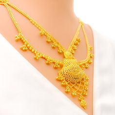 This 22k gold light patta set features a traditional festive tasseled design, perfect for adding elegance to any outfit. Weighing 55.0 grams, it showcases a yellow gold finish that enhances its intricate and celebratory appearance. The set has a length of 24 inches with a 2.5-inch drop and includes adjustable 1.5-inch links for a comfortable fit. Secured with a hook lock, it combines style and practicality. The matching earrings, each 2.2 inches long, feature screw back posts for added security. Gold Zari Weaving Jewelry For Weddings, Gold Wedding Jewelry With Zari Weaving, Festive Gold Jewelry With Zari Weaving, Festive Yellow Temple Necklace, Elegant Gold Temple Necklace With Latkans, Yellow Gold Temple Necklace With Latkans For Celebrations, Festive Yellow Gold Temple Necklace With Latkans, Celebration Yellow Gold Temple Necklace With Latkans, Traditional Yellow Gold Temple Necklace With Elegant Design