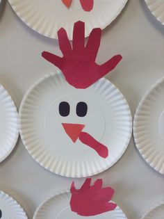 paper plates with handprinted turkeys on them are arranged in the shape of a chicken