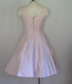 APPROXIMATE MEASUREMENTS (INCHES): Current Size: S Bust: 34 Waist: 25 Hip: FULL Length (shoulder to hem): 41 CONDITION Very Good. There are some extremely light spots on the back right panel of the skirt, and a pinpoint blue spot on the right/front hip (please see photos). DESCRIPTION 1950s pink cotton party dress Natlynn Junior Originals label Fitted bodice with full skirt Floral embroidery under bust Scattered rhinestones on bodice Fitted Bodice Full Skirt Dress For Vintage Events, Vintage A-line Cocktail Dress With Fitted Bodice, 1950s Style Tea Length Dresses, 1950s Style Knee-length Cocktail Dress, 1950s A-line Dress With Fitted Bodice, 1950s Style A-line Dress With Fitted Bodice, 1950s Style Dresses With Fitted Bodice And Full Skirt, 1950s Style Full Skirt Cocktail Dress, 1950s Style Fitted Tea Length Dress