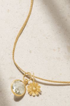 One of the talented artisans behind Pippa Small's eponymous label believes a necklace can "hold each wearer's story." Made from cord and 18-karat gold, this style is strung with a faceted aquamarine pendant alongside a floral charm. It's perfect for a nature lover. Spiritual 22k Gold Necklace With Gemstone, Hammered Yellow Gold Wedding Necklace, Luxury Hammered Necklace For Gift, 22k Gold Necklaces For Anniversary, Luxury Hammered Necklace As Gift, Luxury Hammered Necklaces For Gifts, Wedding Pendant Necklace With Hammered Detail, Exquisite Handmade Yellow Gold Necklace, Luxury 22k Gold Necklaces As Gift