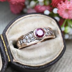 A beautiful vintage 9ct rose gold ring, set with a large central synthetic ruby. A gorgeous piece of vintage Millennium jewellery, this would make a wonderful cocktail or occasional ring. In really nice vintage condition. Please see all of the photos. Stamped with UK hallmarks to the inside for 9ct gold, 1999. UK Size - N US Size - 6 1/2 Weight - 2.7 grams --------------------- All boxes and stands in the photographs are for display purposes only, unless otherwise stated. Please be aware there w Classic Rose Gold Ruby Ring For Anniversary, Vintage Rose Gold Diamond Ring With Gemstone, Heirloom Ruby Ring In Rose Gold For Anniversary, Heirloom Rose Gold Ruby Ring For Anniversary, Hallmarked Rose Gold Round Ruby Ring, Rose Gold Hallmarked Birthstone Ring For Anniversary, Rose Gold Ruby Ring Hallmarked Fine Jewelry, Victorian Rose Gold Ruby Ring For Anniversary, Vintage Ruby Ring With Bezel Setting For Anniversary