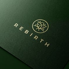 a green business card with the word,'rebirth'written in gold on it