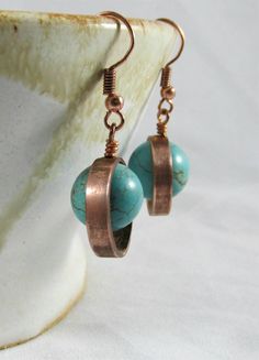 A copper ring with a turquoise bead it the center. These earrings are made from real copper. Simple, but has that perfect earthy pop. Length (including earring wire): Approx. 1 1/2" Width: Approx. 1/2" Turquoise Round Copper Earrings, Boone Nc, Earring Wire, Copper Ring, Creating Jewelry, Copper Rings, Bead Earrings, Turquoise Beads, Beaded Earrings