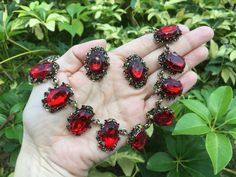 Victorian shaped antiqued brass red glass stones necklace design just perfect to wear on your wedding day! We have added an extra long cable chain for you to adjust the length. Color: antiqued brass with red rhinestones crystals and glass stones  Size: sparkle part measures around 15" long x 0.9" width ** Please note we need to take around 5 days to make it.  Please be patient. ** Item ship out with tracking number to you (around 10 to 14 business days for delivery). We also provide fast shippin Antique Red Necklace For Wedding, Antique Red Wedding Jewelry, Antique Jeweled Red Jewelry, Red Garnet Necklace, Special Occasion Jewelry, Ruby Wedding, Victorian Wedding, Necklace Bridal, Bracelet Crystal