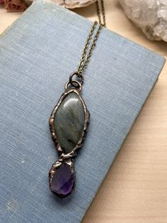 "This listing is for one electroplated statement necklace featuring labradorite and amethyst quartz. It's beautiful and unique, and gives off major Dark Crystal vibes! You may pick the chain length at check out. I recommend between 18-24\" for this necklace, but can do any length from 14-30\". The chain itself may be slightly different than the one in the photograph, depending on what supplies I have available when you order. The chain is nickel, lead, and cadmium free. Your necklace will be sto Electroformed Labradorite Necklaces For Healing, Handmade Minimalist Amethyst Jewelry, Bohemian Purple Hand Forged Necklace, Hand Forged Amethyst Bronze Jewelry, Handmade Amethyst Necklace Nature-inspired, Crystal Vibes, Earring Hole, Dark Crystal, Necklace Amethyst