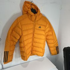 Adidas Itavic Puffer Jacket Mens Orange Size Small. Condition Is New With Tags. Shipped With Usps Ground Advantage. Long Sleeve Down Outerwear For Winter Sports, Sports Long Sleeve Puffer Hooded Jacket, Yellow Puffer Jacket For Winter, Sporty Long Sleeve Down Outerwear, Adidas Fall Outerwear, Adidas Outdoor Fall Outerwear, Adidas Outdoor Outerwear For Fall, Winter Sports Puffer Jacket With Long Sleeves, Yellow Hooded Puffer Jacket For Winter