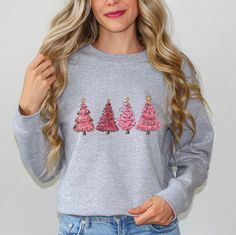 Festive Tree Picking Sweater: Comfy Crewneck perfect for Christmas Party or Gift! Size up 2 sizes for oversized look! Product Description:The Pink Christmas Tree Crewneck is the perfect sweater to add some festive flair to your holiday wardrobe. Featuring a vibrant pink color and a classic crewneck style, this sweater is both stylish and comfortable. The front of the sweater showcases a charming Christmas tree design, complete with colorful ornaments and a sparkling star on top. Made from high-q Christmas Tree Sweater, Tree Sweater, Crewneck Style, Unique Holiday Gifts, Pink Christmas Tree, Holiday Wardrobe, Christmas Tree Design, Camping Gifts, Kids Sweater