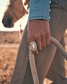 Be the talk of the town (or rodeo!) with the Wrangler® x Yellow Rose by Kendra Scott Laurel Vintage Gold Statement Ring in Ivory Mother of Pearl. The ring’s floral silhouette combines iconic Kendra Scott shapes and design details with Southwest-inspired materials for a one-of-a-kind ring you won’t see anywhere else. No matter where you are, you’re going to want to roll up your sleeves and let this statement maker shine. This ring is part of the Wrangler® x Yellow Rose by Kendra Scott collection, Laurel Ring, Western Rings, Urban Cowgirl, Wrangler Accessories, Floral Silhouette, Christian Bracelets, Western Women, Gold Statement Ring, Western Jewelry