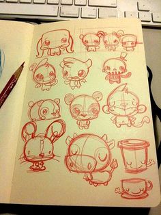 a bunch of cartoon animals drawn on paper next to each other with red marker pens