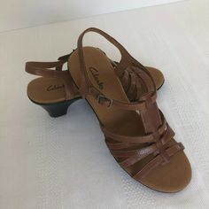 Women's Clark's Sandals Brown Leather size 8.5M Women's, pre-owned shoes, excellent condition. 30-day returns accepted in original condition as received by buyer. Feedback: When you receive your purchased item and are satisfied with the product, please leave us positive feedback. If for any reason you are not satisfied with your purchase from us, please contact us.  We will work with you to resolve any concerns or issues. Please don't leave neutral or negative feedback without giving us an oppor Closed Toe Synthetic Sandals With Heel Loop, Classic Open Toe Synthetic Sandals, Classic Synthetic Sandals Medium Width, Round Toe Synthetic Sandals With Heel Loop, Classic Open Heel Synthetic Sandals, Adjustable Slingback Sandals With Heel Loop And Round Toe, Brown Casual Sandals With Padded Heel, Cushioned Round Toe Sandals Medium Width, Casual Brown Sandals With Padded Heel