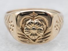 This stunning yellow gold signet ring boasts a delicate floral design. Crafted to the highest quality standards, this ring ensures elegance and style with every wear. The perfect accessory for any occasion.Metal: 14K Yellow GoldTop Measurements: 9.5 mm, SquareRing Size: 5.50 Classic 14k Gold Flower Ring, Classic Oval Yellow Gold Flower Ring, Classic Oval 14k Gold Flower Ring, Classic 14k Stamped Yellow Gold Flower Ring, Classic Oval Flower Ring In 14k Gold, Classic 14k Gold Flower Ring For Anniversary, Classic 14k Gold Flower Ring For Formal Occasions, Classic 14k Gold Flower Promise Ring, Classic 14k Stamped Flower Promise Ring