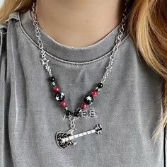 𝔇𝔢𝔱𝔞𝔦𝔩𝔰: Style: Egirls, Y2K, Kawaii Goth Materials: Alloy Metal & Stone Quantity: 1 pc (As shown) This is a handmade one with special star & cross beads to create a punk & edgy vibe. Rock out in style with this flaming guitar necklace. It will make for a fantastic addition to your accessory collection - whether at school or bands Solid & durable quality Enjoy free shipping with a purchase of over 80$ Harajuku Style Black Jewelry, Trendy Handmade Jewelry For Concerts, Handmade Black Jewelry For Concert, Handmade Black Jewelry For Concerts, Black Rock Jewelry, Black Harajuku Style Jewelry Gift, Casual Black Necklace For Streetwear, Black Handmade Kpop Jewelry, Handmade Black Kpop Jewelry