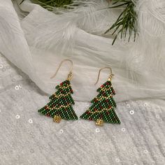 "NEW, Fall/Winter Plaid Earring Collection perfect for Fall sweater weather or Fall/Winter and Holiday season. Light and airy beaded plaid trees, Christmas trees and even festive trees for New YearS.  Handcrafted with woven Delica beads suspended from 14kt gold filled sparkle twisted ear wires.  Perfect for casual, smart casual and holiday attire.  Created With:   Professional quality designer beading thread, Miyuki delica beads, 14kt gold wire cover, 14kt gold ear wires. Length:  2 inches from top of ear wire to bottom of beaded tree and very lightweight.  This listing is for ONE (1) pair of earrings in your color choice of Green Christmas Tree, White Christmas Tree, Red Check, Black Check, Green Check,or Tartan plaid. Please make color choice at check out.   **If you would like lever bac Beaded Trees, Beaded Tree, Beaded Projects, Wire Cover, Holiday Beading, Earrings Fall, Beading Thread, Winter Plaid, Red Christmas Tree