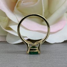 This ring is a trillion lab created green emerald made in solid 14k yellow gold item #5843 Ring has split shank design and 3 prong setting. Emerald is the birthstone for May Gem Type: lab created emerald -Shape: Trillion / 7x7MM -Weight: 1.00ct (approx.) diamond equivalent -Stone Color: Lively Medium Green, Eye-clean / The Best Color in Emeralds -Hardness: 8.5 Moh's Scale Mounting: -Metal Type and Purity: 14k yellow gold -Setting: 3 prong split shank design -Listed Ring Size: 6.5 -Country of Man 14k Gold Princess Cut Emerald Ring, Trillion Cut Emerald Ring For Formal Occasions, Classic Trillion Cut Emerald Ring For Formal Occasions, Classic Formal Trillion Cut Emerald Ring, Classic Trillion Cut Emerald Ring With Prong Setting, Classic Trillion Cut Emerald Ring, Princess Cut Emerald Ring In 14k Gold, Formal Trillion Cut Emerald Ring, Gold Emerald Solitaire Ring With Baguette Cut