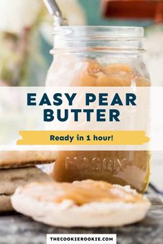 a jar filled with peanut butter next to cookies