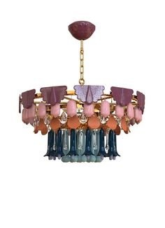 a chandelier hanging from the ceiling with lots of colorful glass beads on it