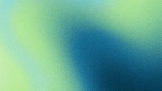 a blurry image of blue and green colors