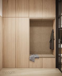 an empty wooden bench in the middle of a room